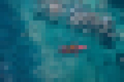 Abstract teal and blue pixelated background image.